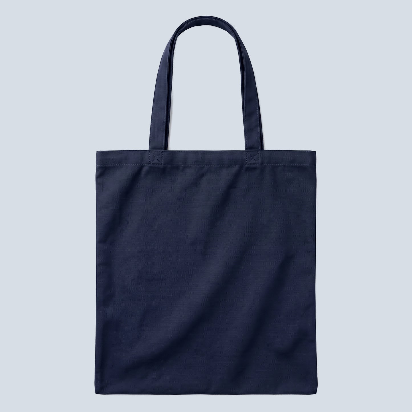 Wilde (Stars) quote tote bag by Subtext – back view of the navy canvas tote with zip closure, unprinted.
