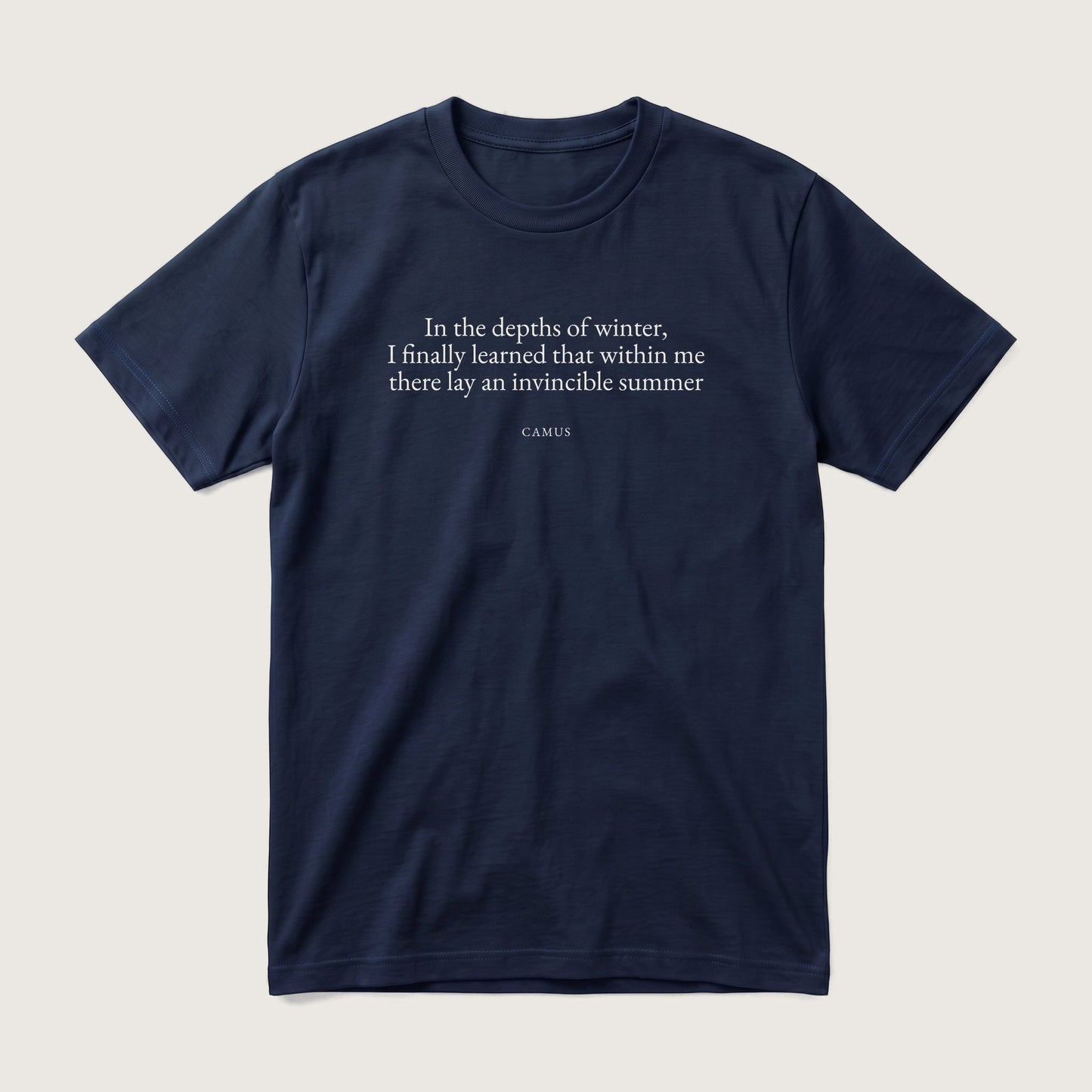 Camus quote classic t-shirt by Subtext – cream E.B. Garamond text on a navy cotton tee, front view.