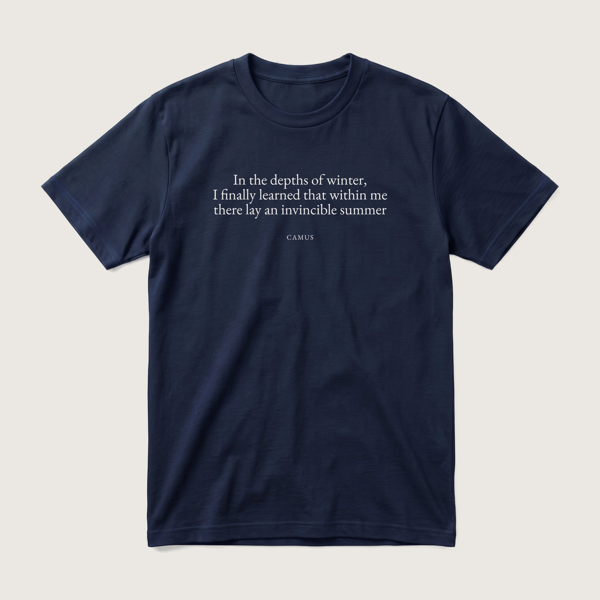 Camus quote classic t-shirt by Subtext – cream E.B. Garamond text on a navy cotton tee, front view.