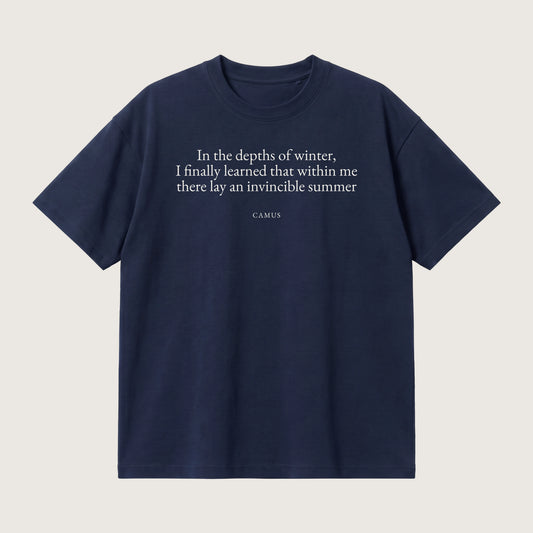 Camus quote oversized t-shirt by Subtext – cream text on a navy oversized cotton tee, front view.