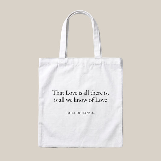 Emily Dickinson quote tote bag by Subtext – black text on a white canvas tote with zip closure, front view.
