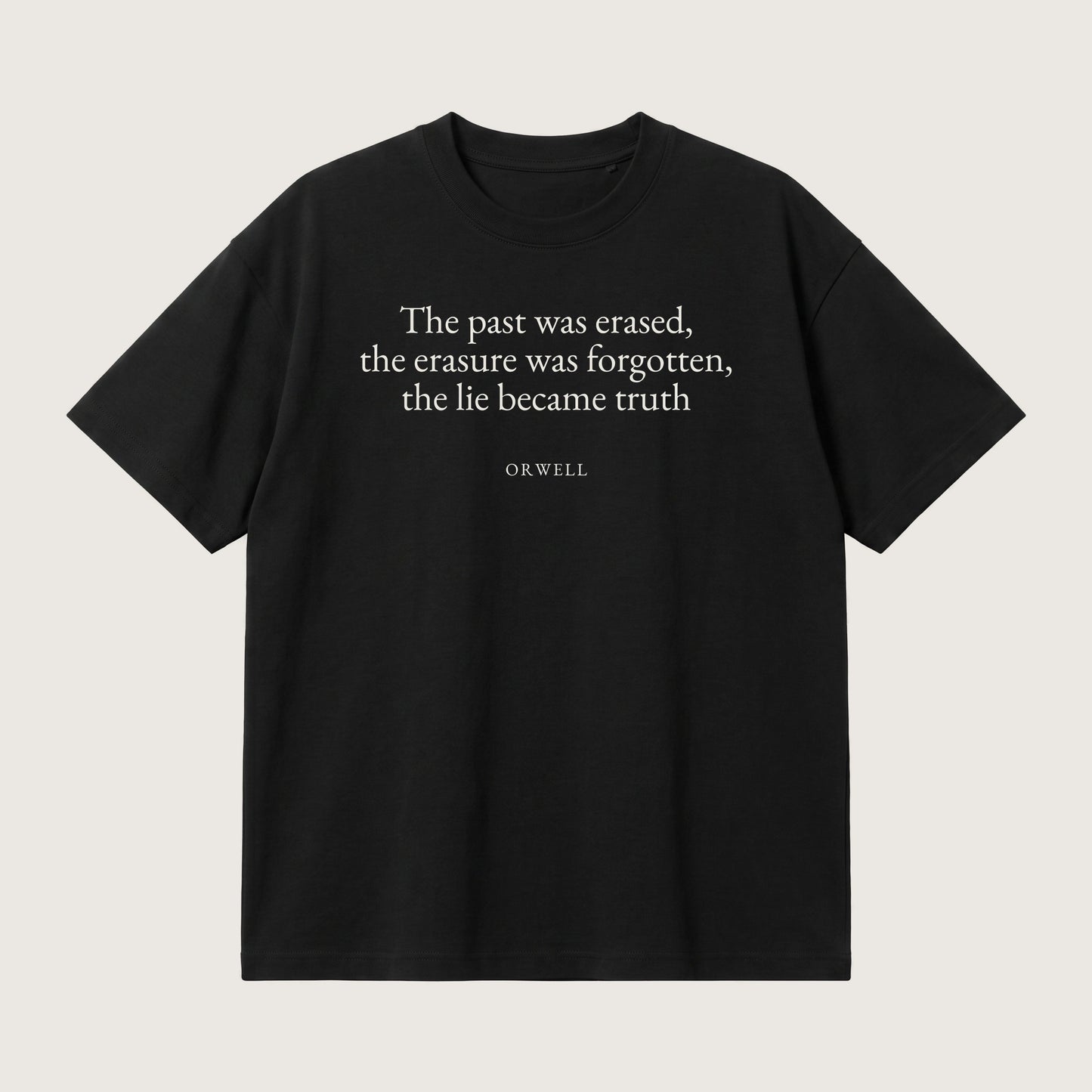 Orwell quote oversized t-shirt by Subtext – cream text on a black oversized cotton tee, front view.