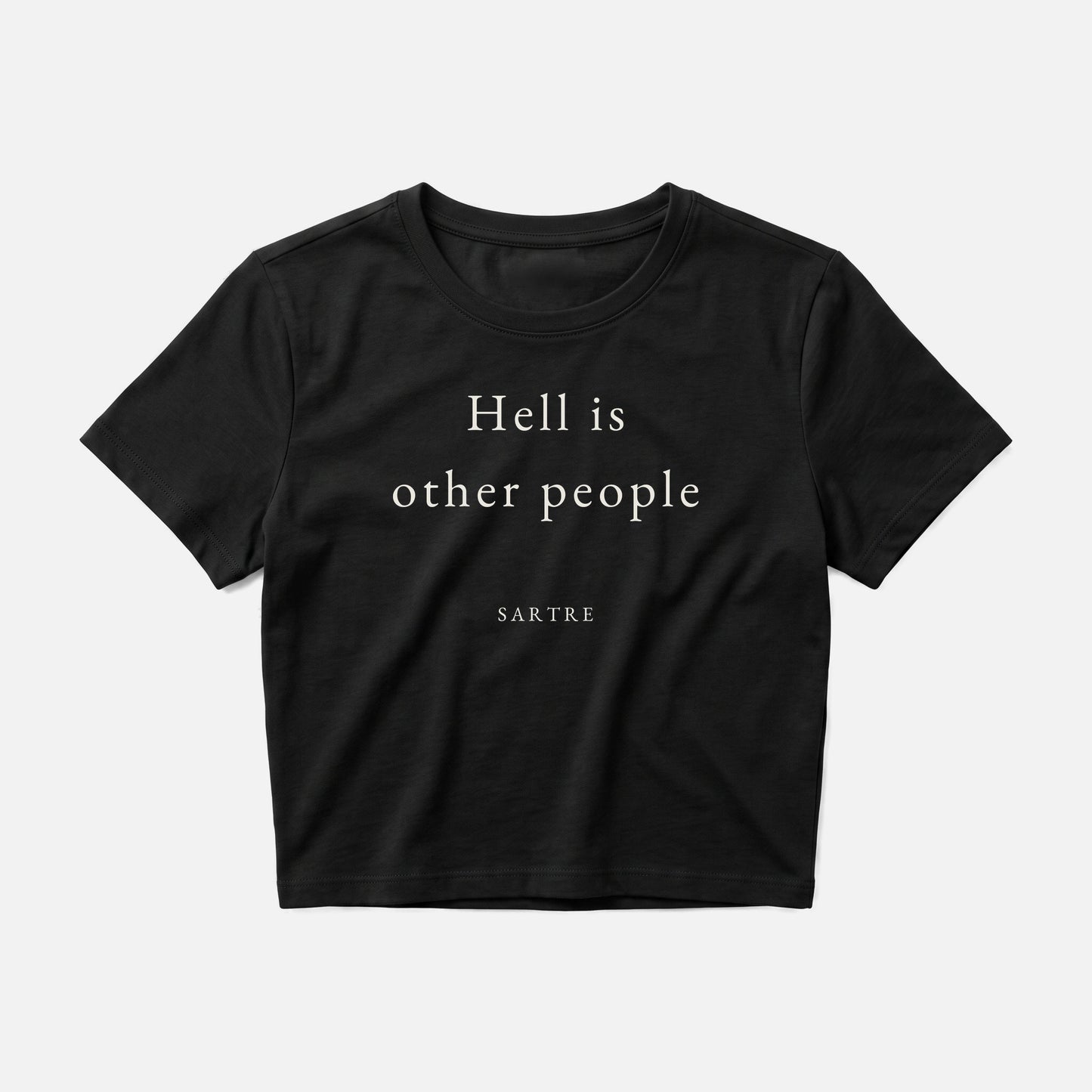 Sartre quote crop top by Subtext – cream text on a black cotton crop top, front view.