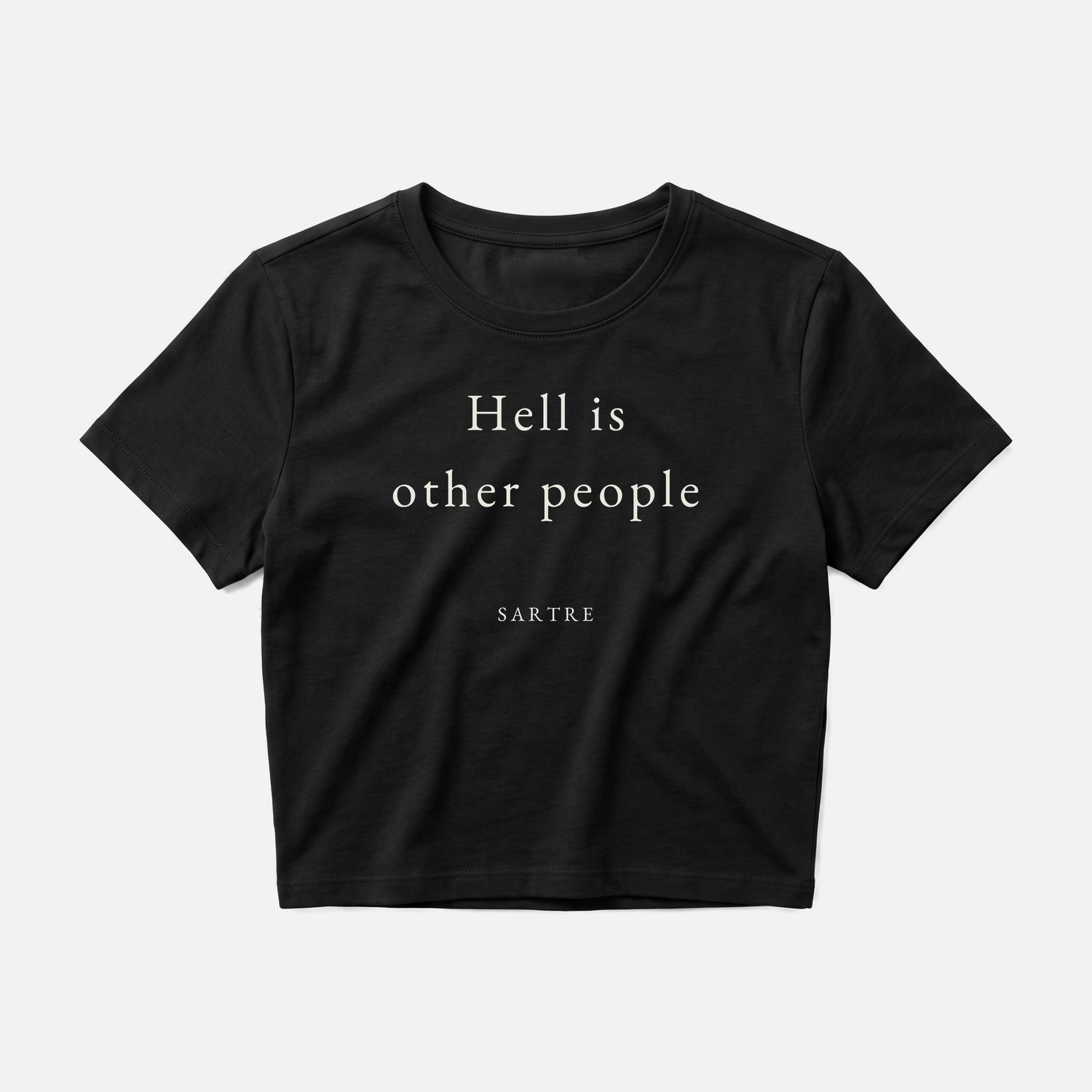 Sartre quote crop top by Subtext – cream text on a black cotton crop top, front view.