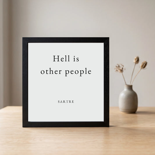Sartre quote framed poster (10×10) by Subtext – cream text on stone art paper in a black frame.