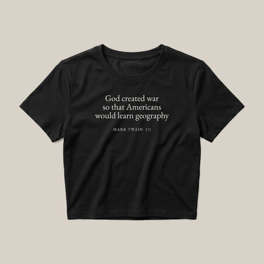 Mark Twain (attributed) quote crop top by Subtext – cream text on a black cotton crop top, front view.