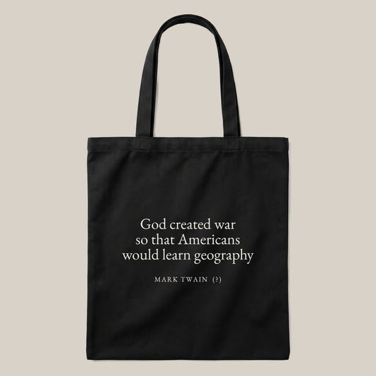 Mark Twain (attributed) quote tote bag by Subtext – cream text on a black canvas tote with zip closure, front view.