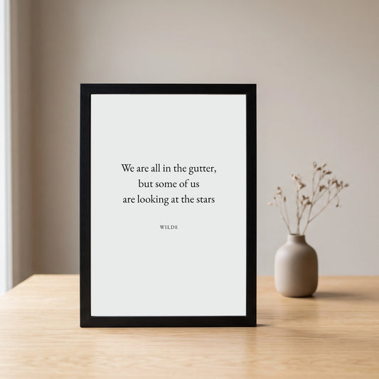 Wilde (Stars) quote framed poster (A4) by Subtext – cream text on stone art paper in a black frame.