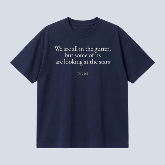 Wilde (Stars) quote oversized t-shirt by Subtext – cream text on a navy oversized cotton tee, front view.